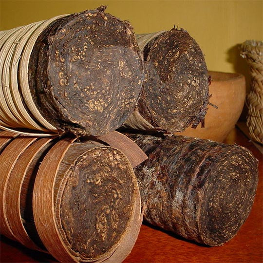 The cut ends of rolls of Brazilian rope tobacco, bound in dried leaf and cane.