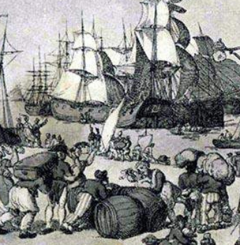 Old engraving of a busy harbour, with tall sailing ships at anchor and dock workers rolling barrels and carrying sacks on the quay.